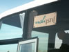 The Just You sign back in the coach, after the group photo 